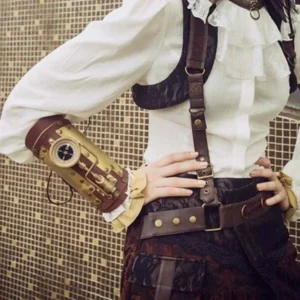 Steampunk compass forearm armor styled with ruffled vintage blouse and leather suspender belt, three-quarter view on model