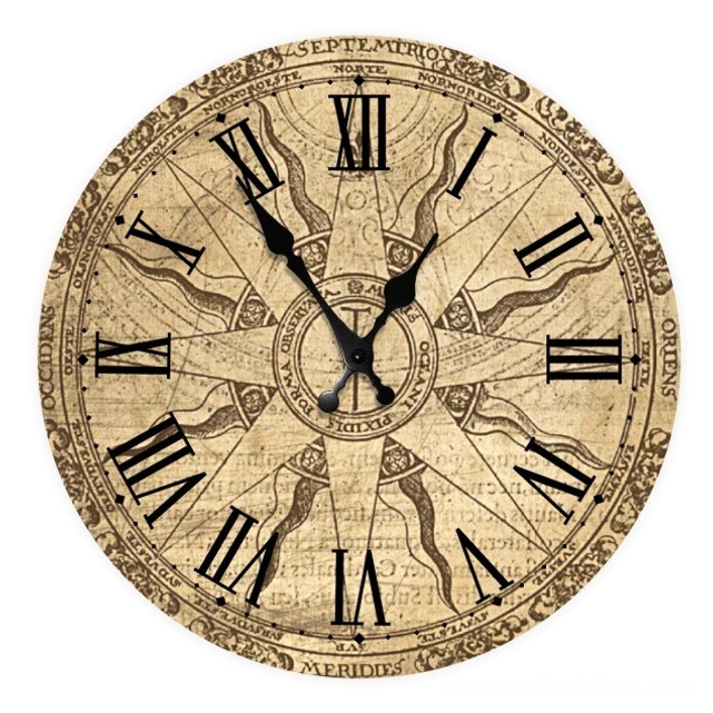 Compass 2 clock face extreme close-up showing black Roman numerals, nautical border detailing, and brass-finished clock hands