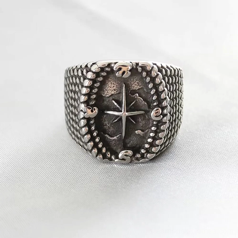 Vintage compass steampunk signet ring front view featuring aged silver-black finish with detailed north star compass motif and textured band