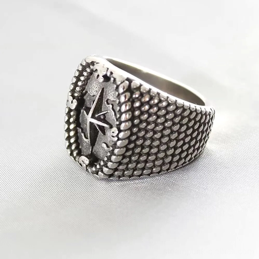 Top-side view of steampunk compass signet ring displaying full textured ring band with clear north star compass design and vintage silver tone finish