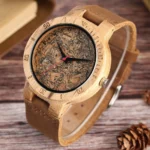 Steampunk cork wood watch with marbled dial and red second hand, 3/4 angle view on wooden desk with vintage decor