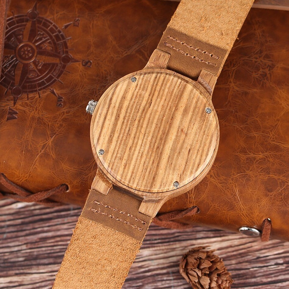 Rear view of wooden steampunk watch showing screw-fixed solid wood back cover and engraved leather strap