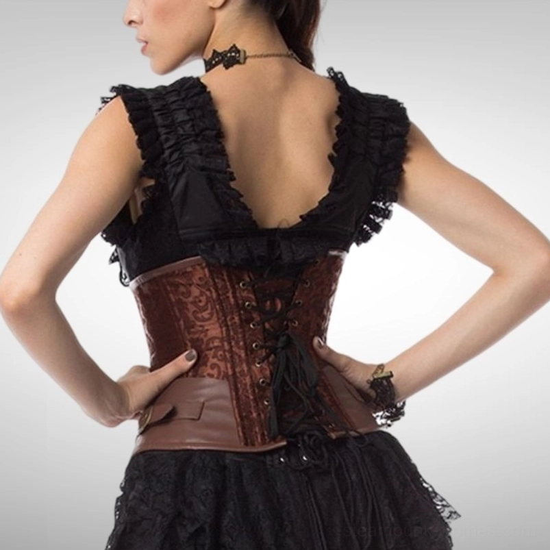 Back view of steampunk underbust corset showing lace-up closure and leather waist panel on model