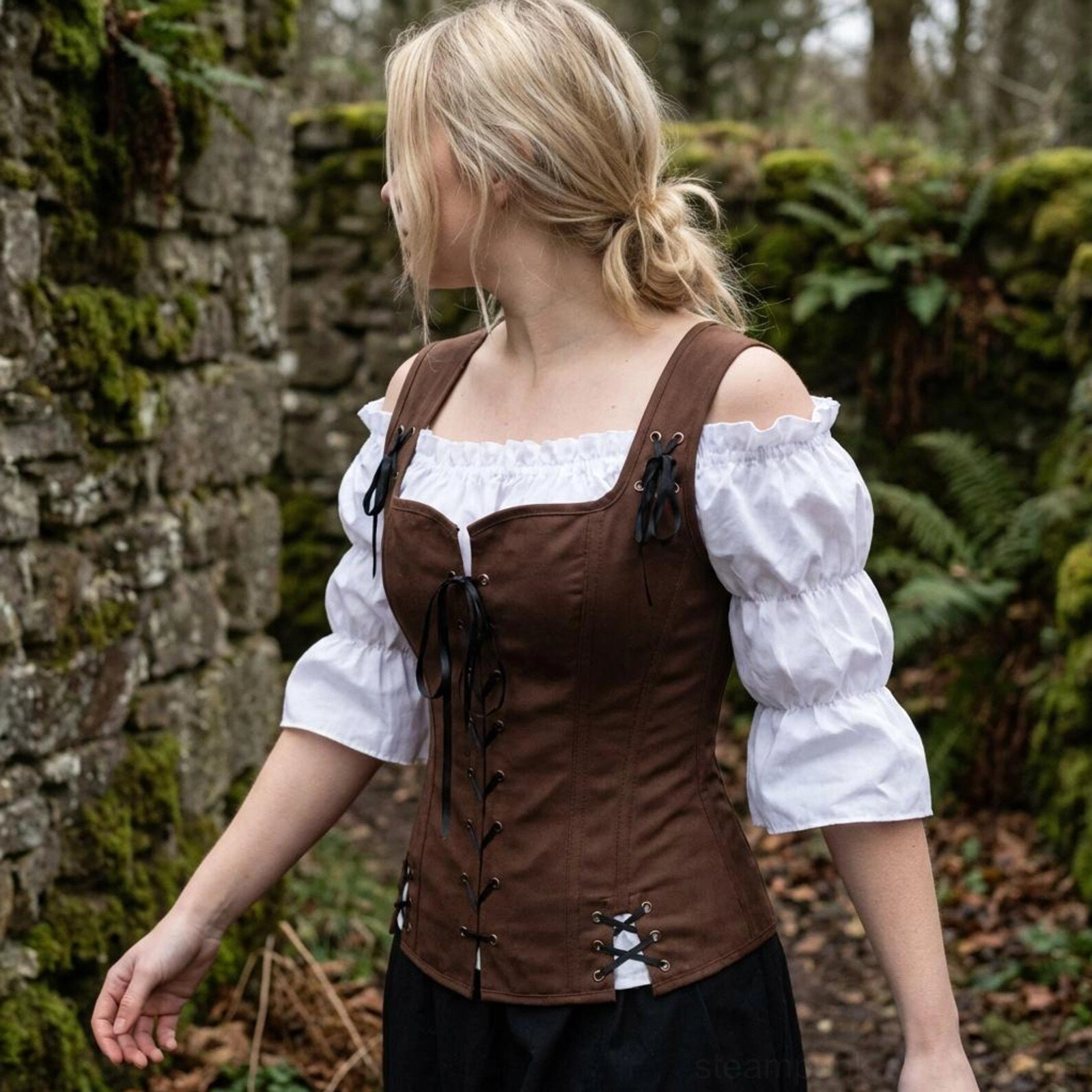 Steampunk corset side and back view on model wearing black skirt in outdoor woodland setting