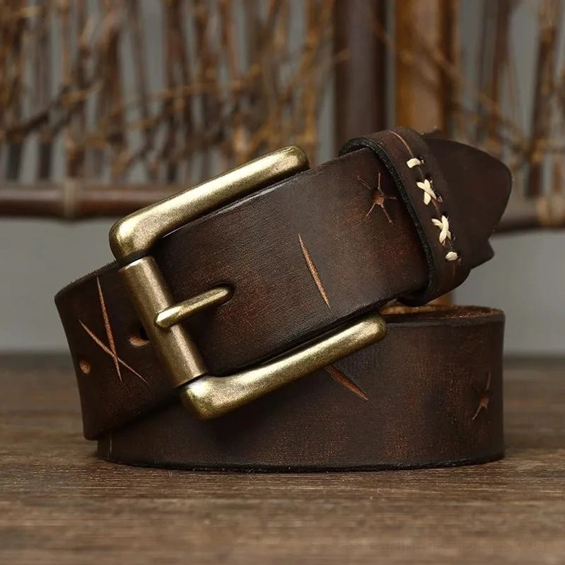 Men's steampunk leather belt laid flat displaying full-length view of dark brown genuine leather, double cross-stitch and slash engraving details, antique brass buckle mechanism—showcasing authentic industrial aesthetic and detailed craftsmanship