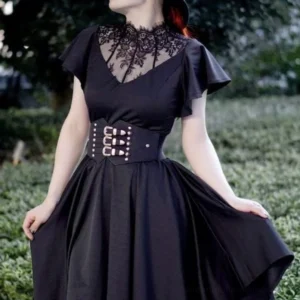 Steampunk corset waist belt with triple silver engraved buckles and stud details styled on model wearing black vintage gothic dress in garden