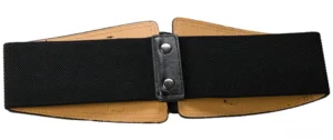 Steampunk elastic corset belt side profile displaying dual-tone leather construction with black exterior, tan inner lining, and military-grade snap fasteners, side flat lay