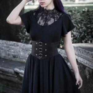 Black gothic corset waist belt worn by model with dark hair outdoors on stone terrace over lace dress, demonstrating steampunk belt styling with alternative fashion pairing and real-world wear