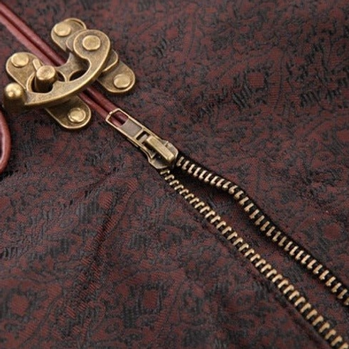 Close-up of bronze metal zipper and metal clasp hardware on steampunk corset