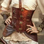 Brown brocade underbust steampunk corset with vintage brass locks and decorative zippers front view closeup detail
