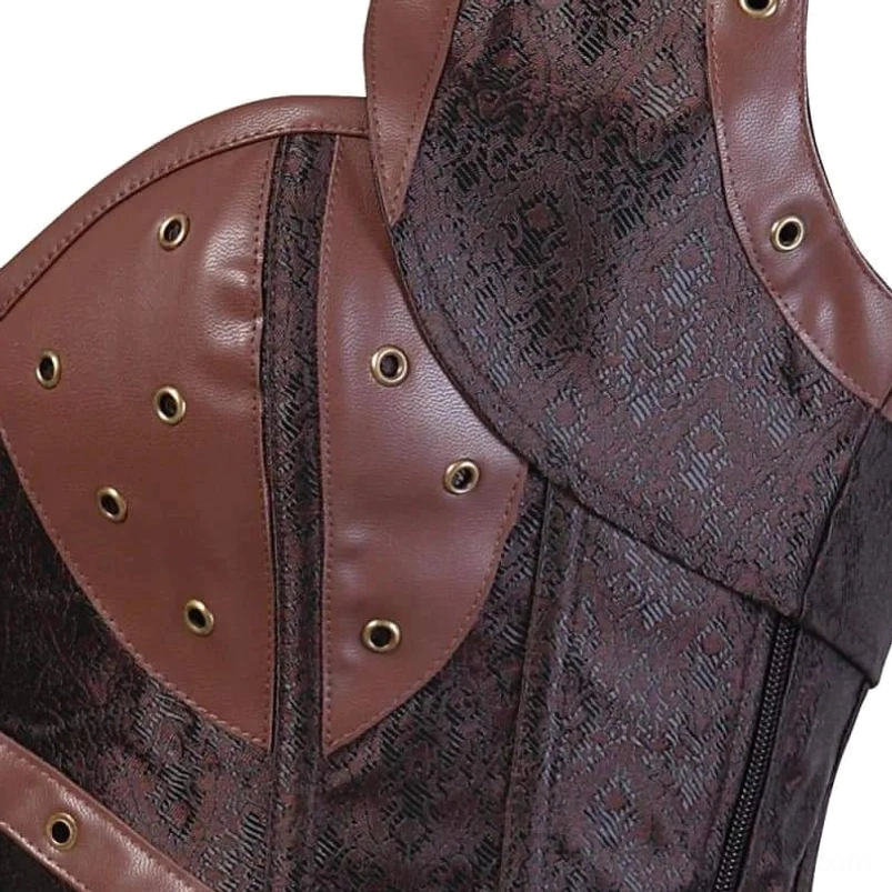 Steampunk corset chest and shoulder panel detail featuring bronze metal eyelets, brown vegan leather panels and ornate jacquard fabric base