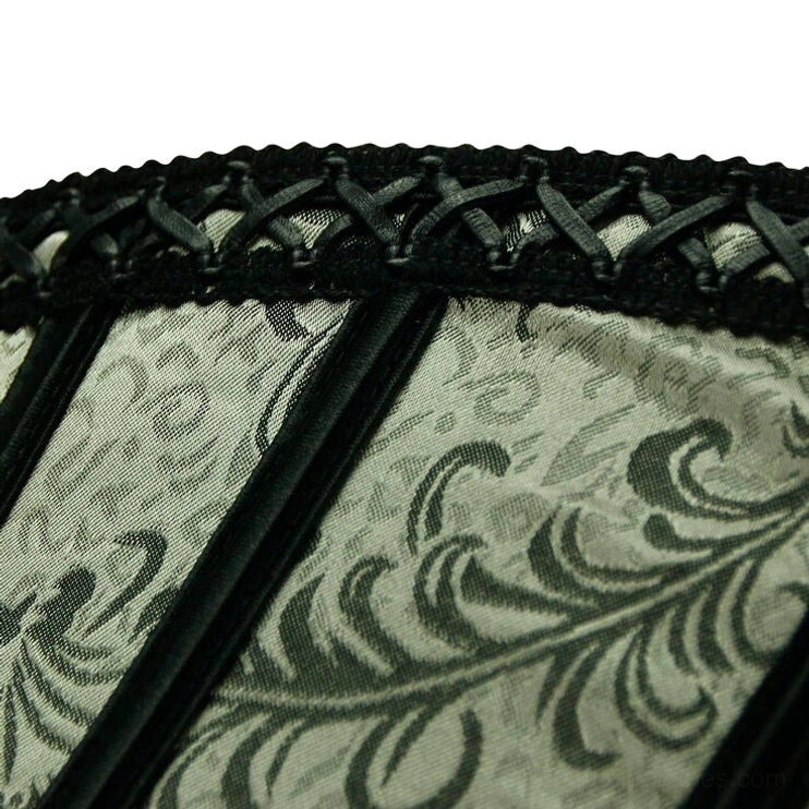 Close-up detail of floral damask fabric texture, black satin trim, crisscross lace trim, and two-tone steampunk corset construction