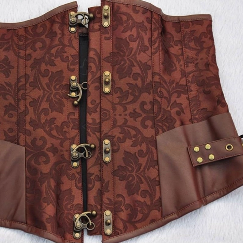 Flat lay product photography of brown steampunk corset showing full construction with copper hook closures and jacquard fabric texture