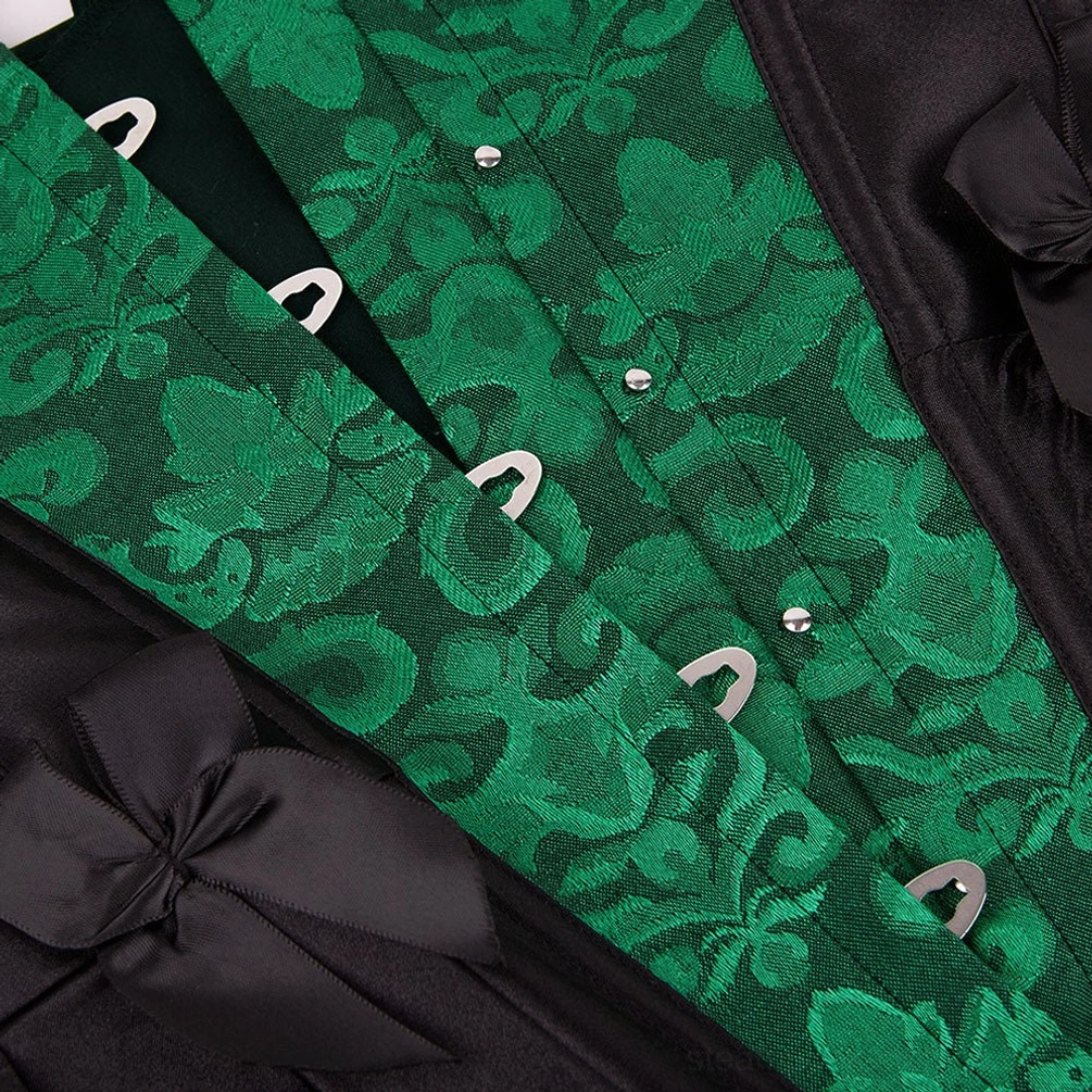 Close-up detail of steampunk corset front showing intricate green damask fabric weave, metal hook fasteners, and satin bow trim embellishment