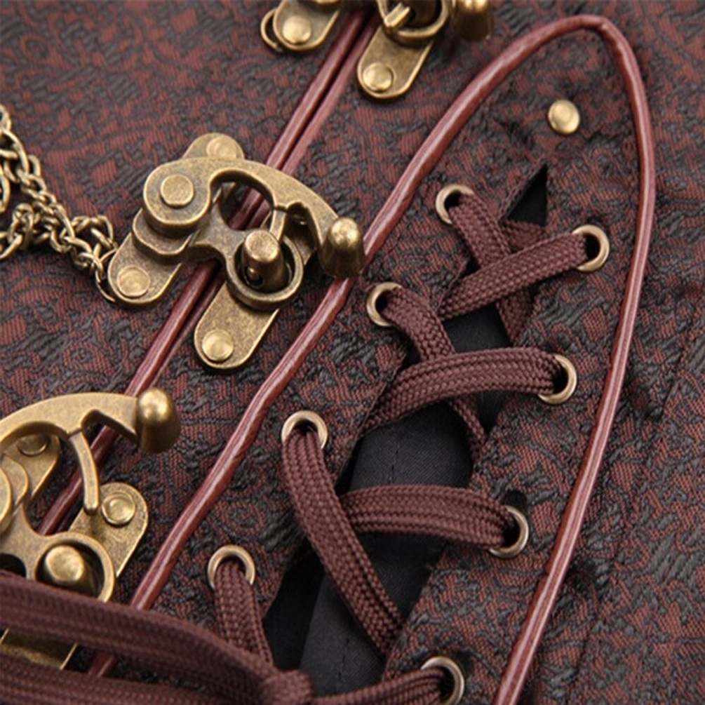 Close-up detail of steampunk corset front hardware including antique bronze buckles, brown lace cords, and linked metal chains