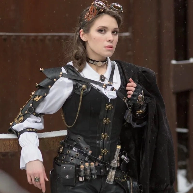 Complete steampunk outfit featuring black overbust corset with corset paired with gothic accessories and rustic industrial background styling