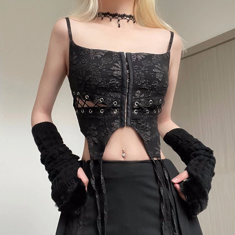 Close-up detail of black gothic steampunk corset showing exposed waist cutout and lace-up construction with metal hardware