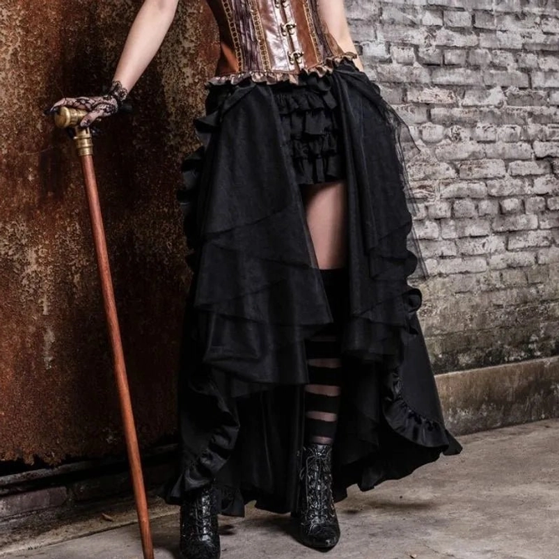 Brown leather steampunk corset paired with black high-low overlay skirt, complete styling with walking cane and industrial brick setting