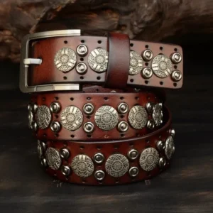 Steampunk cowboy belt in genuine reddish-brown leather featuring hand-embossed silver metal studs and engraved vintage buckle with industrial detailing for alternative fashion