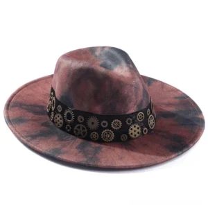 Steampunk cowboy fedora hat with tie-dye reddish-black fabric and brass gear hat band, front-left side view on white background