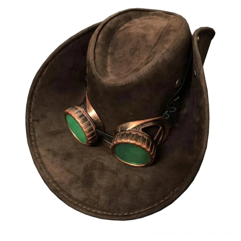 Steampunk cowboy hat with removable bronze goggles and green lenses, left three-quarter view showcasing dark brown suede texture and vintage-inspired design