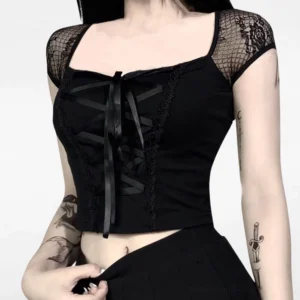 Black gothic steampunk cropped lace top with satin ribbon lace-up front and fishnet cap sleeves, front view on model