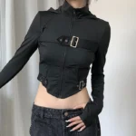 Black steampunk cropped zip jacket with metal buckle decorations and fingerless sleeves, three-quarter front view on model