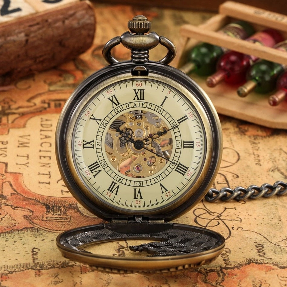 Open steampunk pocket watch case revealing exposed gear mechanism and skeleton movement with antique metal finish