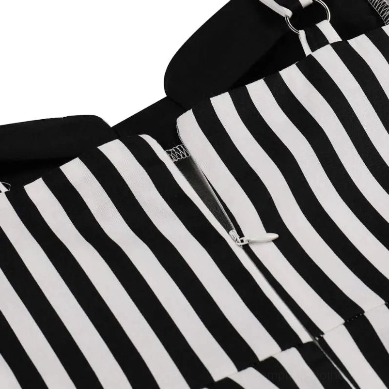 Back zipper detail of steampunk dress showing metal closure, neat reinforced stitching, and striped fabric on white background