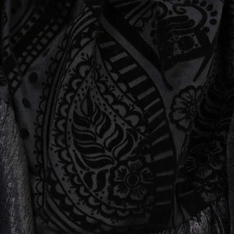 Gothic steampunk dress lace pattern detail featuring paisley floral embroidered design in black-on-black sheer texture, intricate craftsmanship