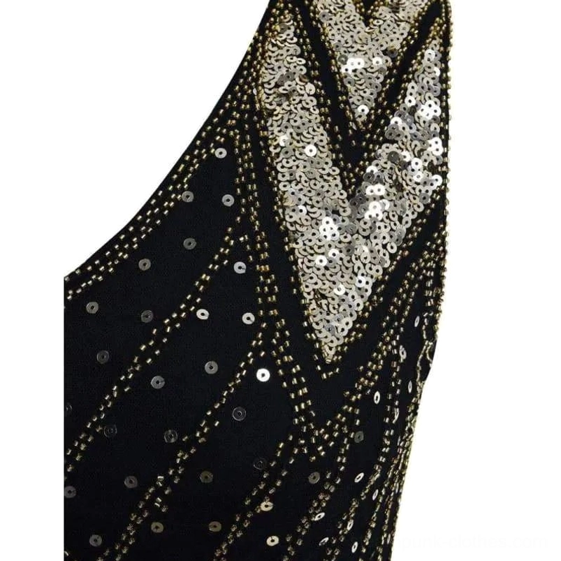 Steampunk dress neckline detail featuring chevron sequin trim, gold beaded lines, and intricate round sequin accents