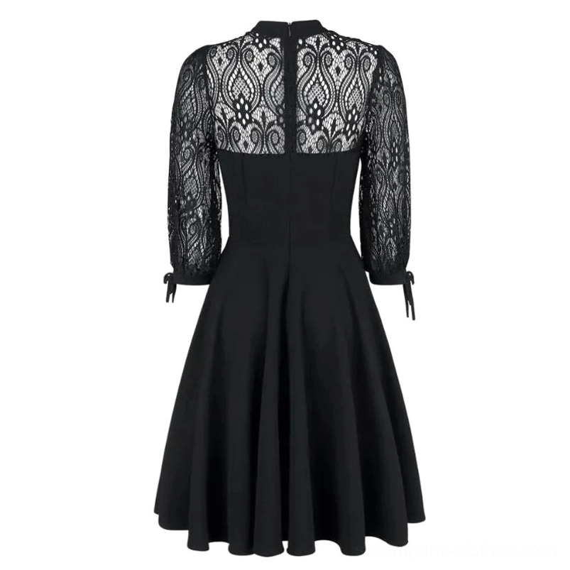 Flat lay back display of black steampunk cocktail dress revealing decorative lace back panel, zipper closure, and tie cuff sleeve straps