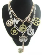 Steampunk dual-layer chain necklace with gear and pocket watch pendants displayed on black jewelry mannequin, front view showing intricate charms and mixed metal tones