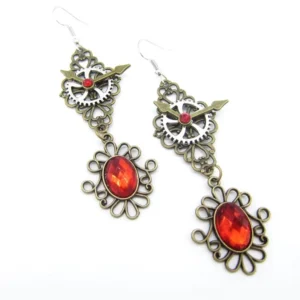 Vintage steampunk earrings featuring red oval gem pendant with bronze gear and metal chain construction