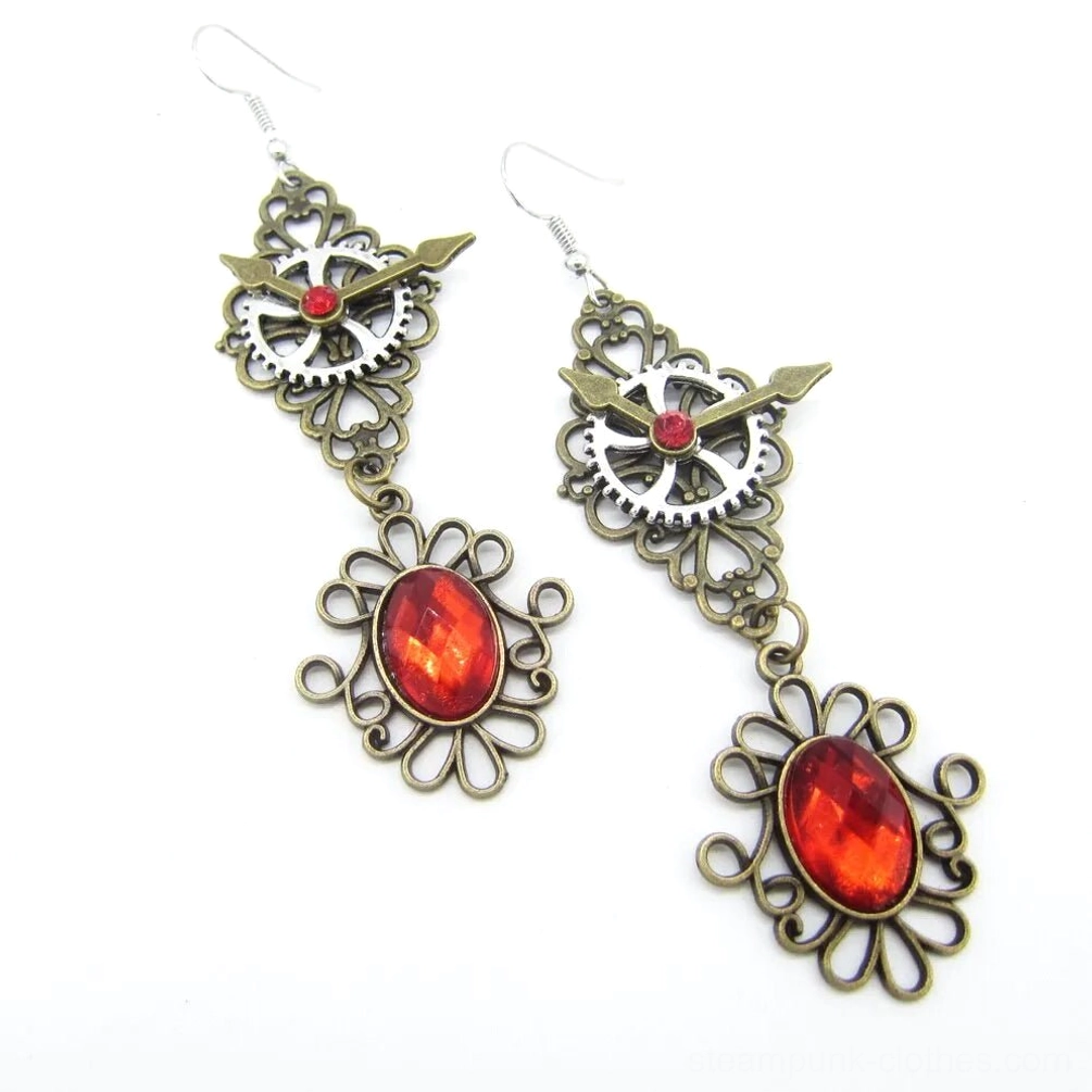 Vintage steampunk earrings featuring red oval gem pendant with bronze gear and metal chain construction