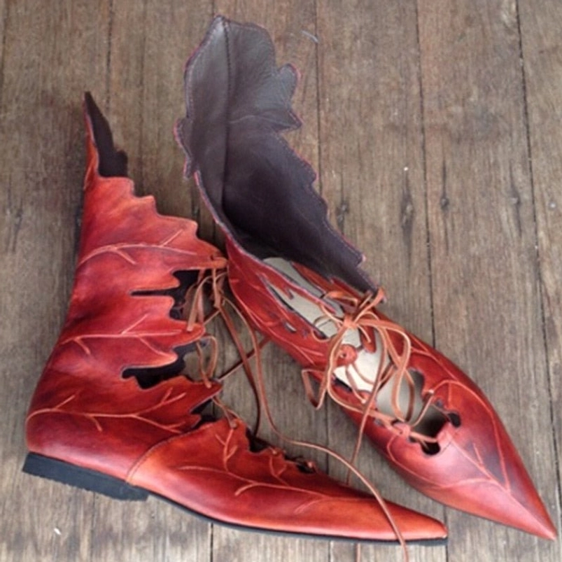 Red burgundy steampunk elf lace-up flats with leaf cutout design and brown lacing, side profile
