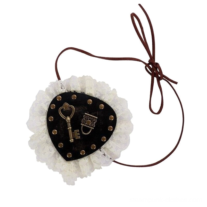 Steampunk Lolita eye patch side overhead view showcasing cream lace trim vintage metal hardware and adjustable brown tie string