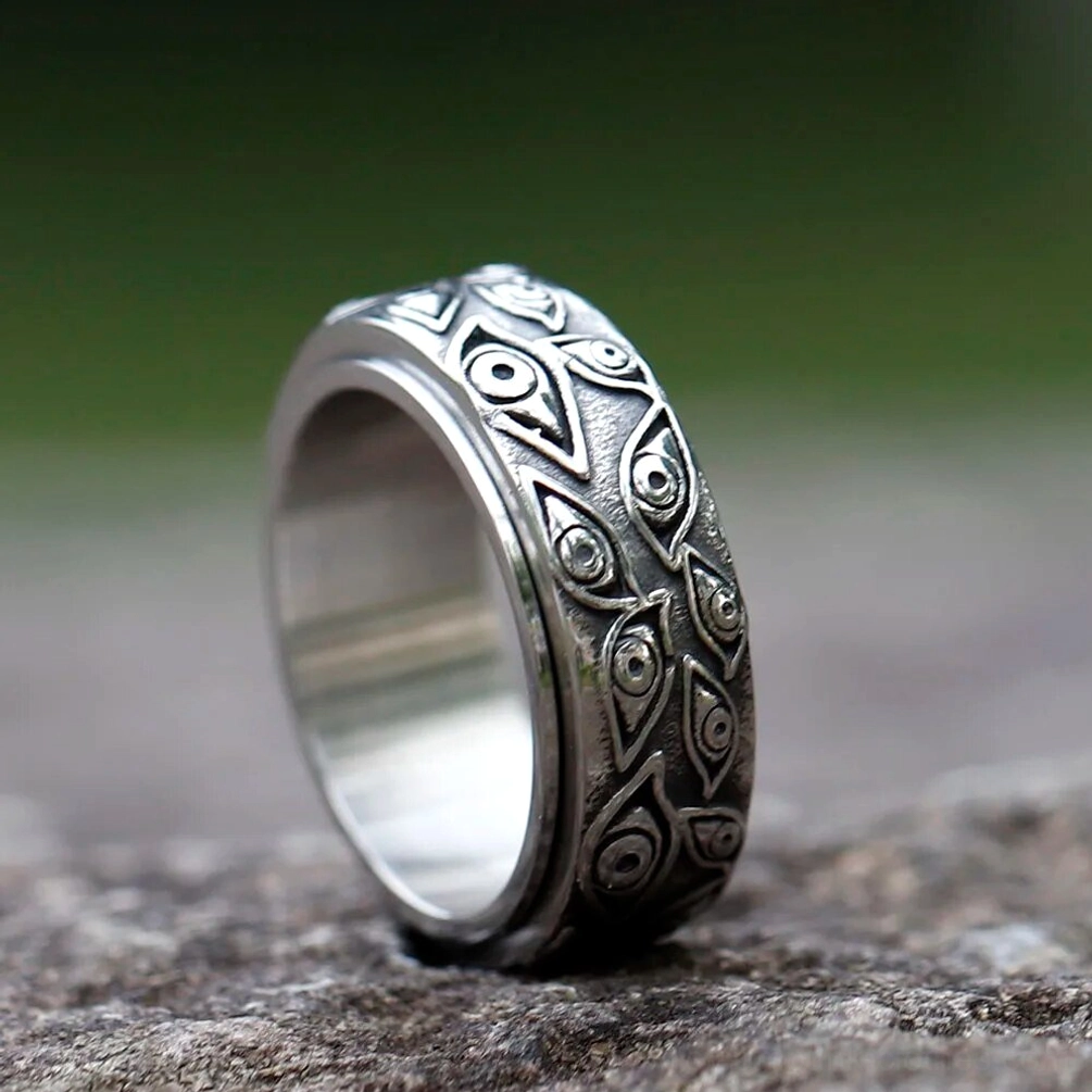 Distressed antique silver steampunk eye ring with repeating eye design - low angle detail showing industrial aesthetic