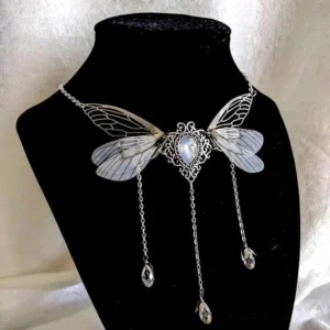 Steampunk fairy wing tassel choker necklace with translucent dragonfly wings, vintage silver frame, teardrop moonstone center, and three crystal tassel pendants displayed on black mannequin