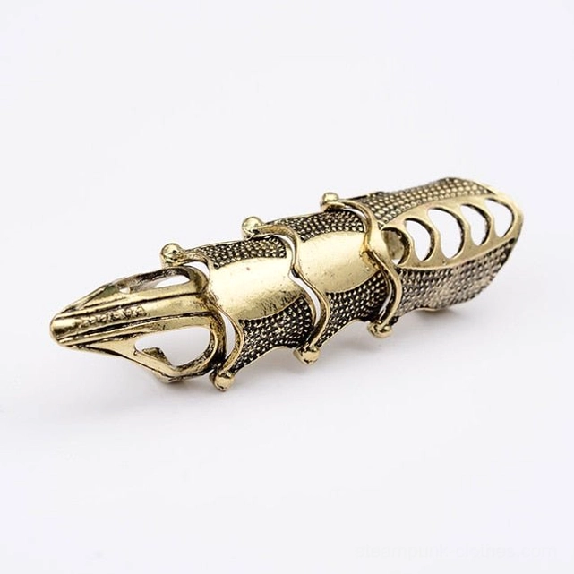 Antique bronze steampunk finger armor with two-tone gold and dark metal curved articulated structure and hollow cutouts