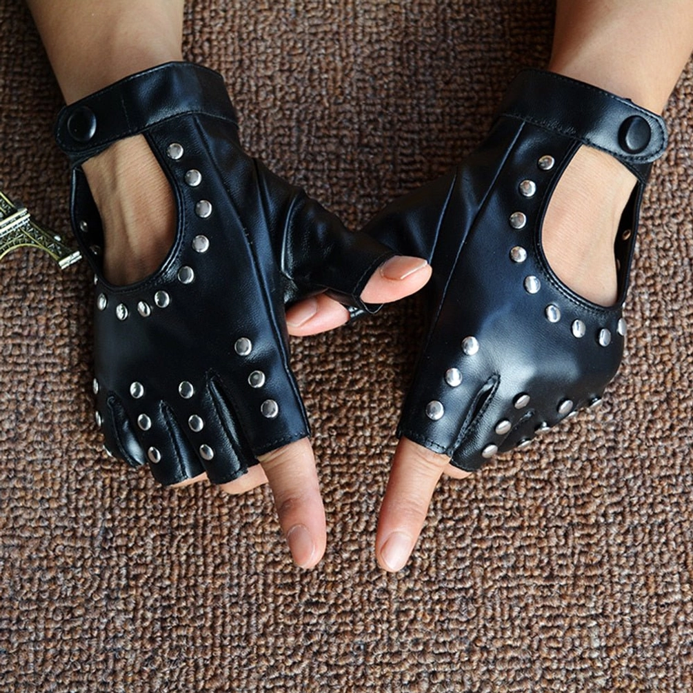 Matte black fingerless studded gloves side overhead close-up, hands wearing gloves, metal snap wrist strap, brown carpet