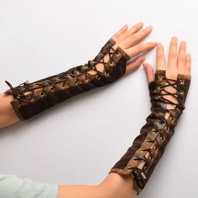 Two human arms wearing brown steampunk fingerless gloves displaying full lace detailing, metal grommets and distressed trim in top-down view