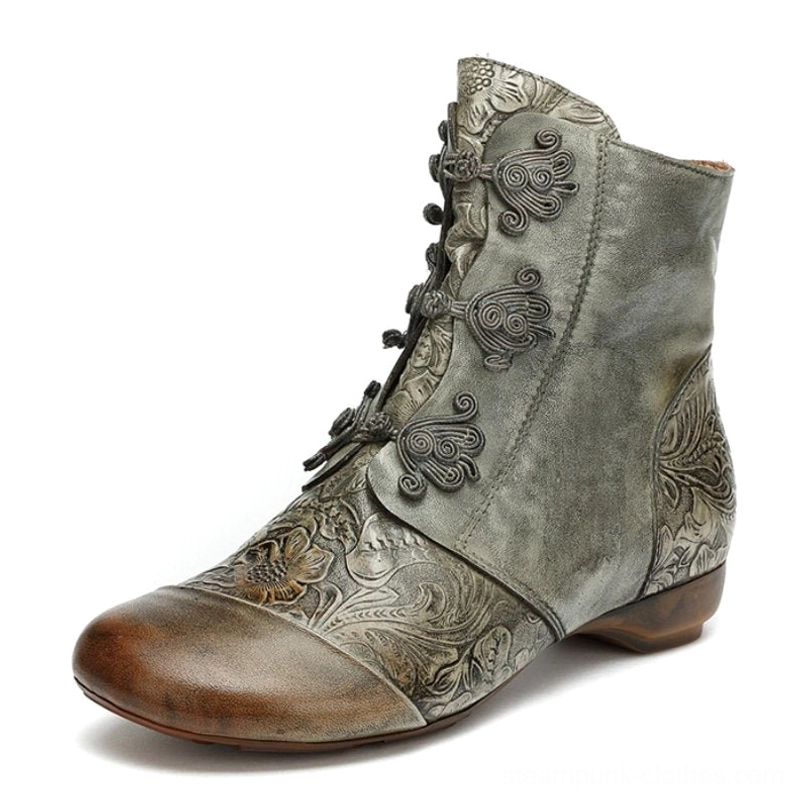 Steampunk flat ankle boots with embossed leather and brown toe cap, featuring frog button closures - three-quarter side view