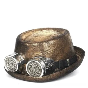 Steampunk gambler fedora hat with integrated removable goggles, distressed antique gold leather finish with weathered cracking detail, front facing studio view