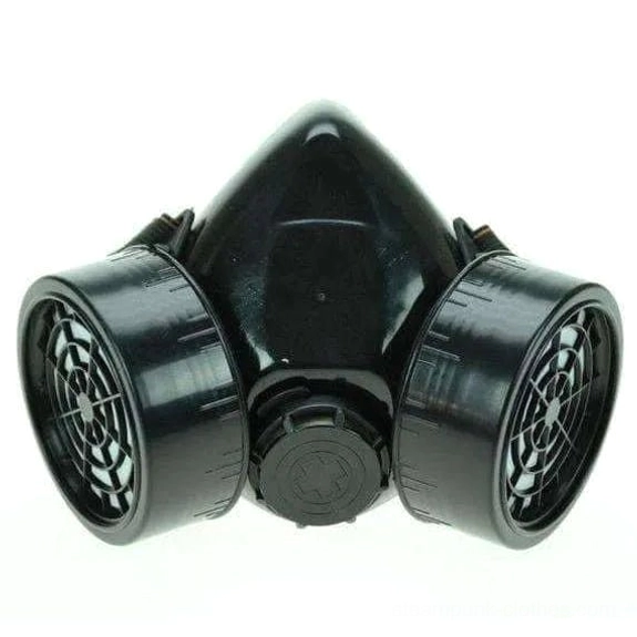 Black matte plastic dual-cartridge steampunk gas mask front view with grid-patterned filter vents and central adjustment dial on white background