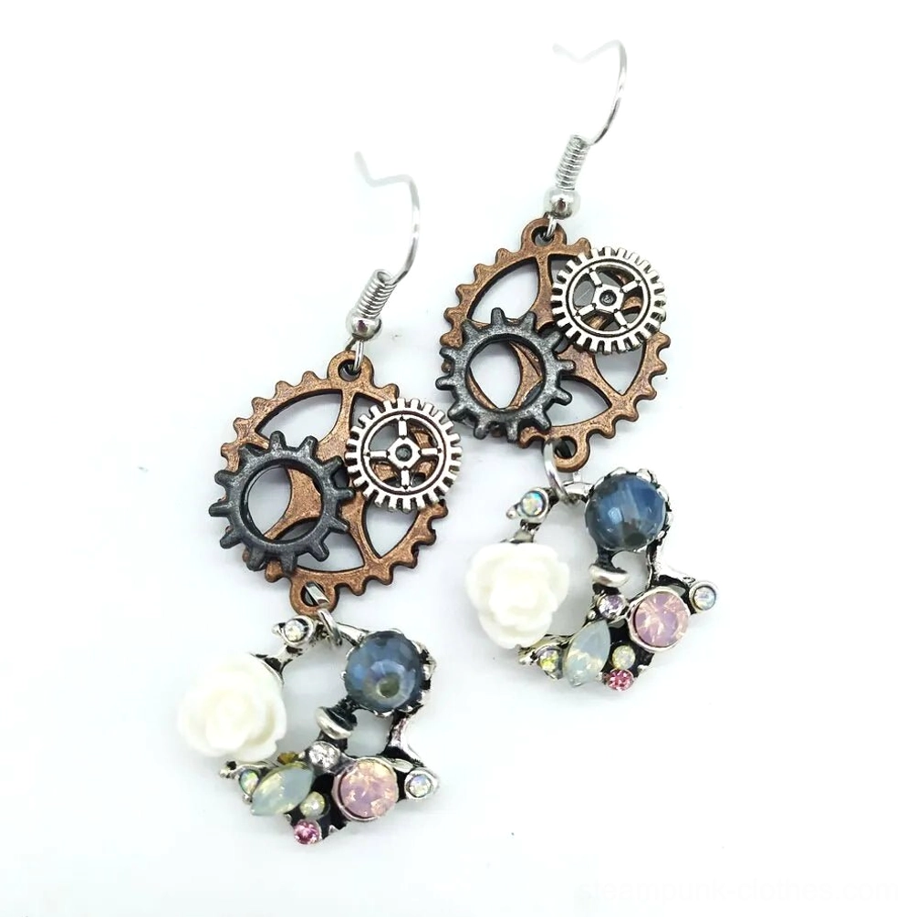 Single pair of steampunk gear drop earrings with vintage gears and resin flowers shown from side profile