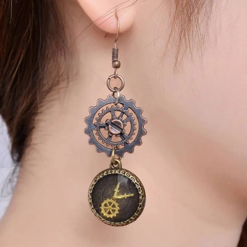 Single steampunk gear drop earring worn on female ear, side view close-up showcasing antique bronze clock and mechanical elements