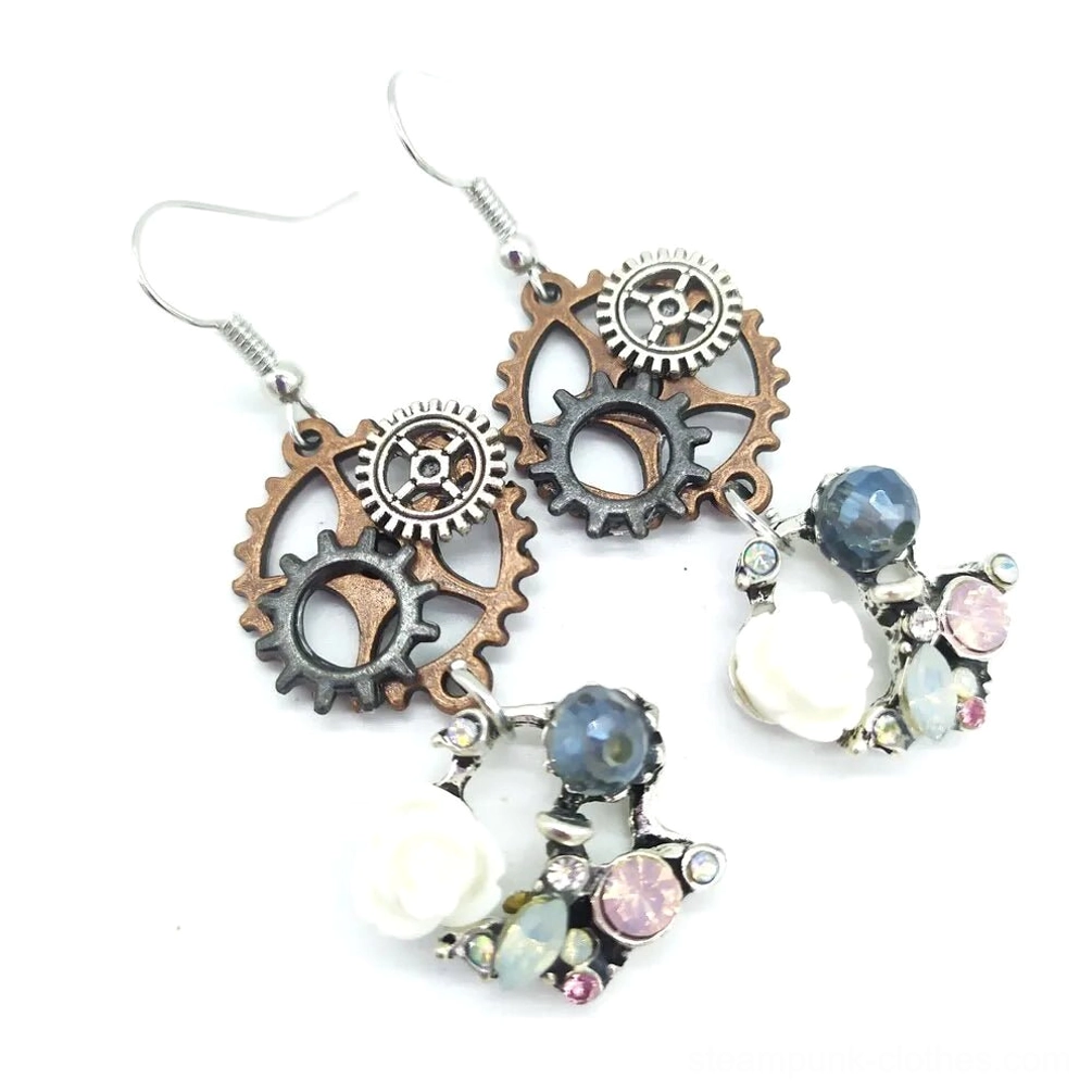 Two pairs of steampunk gear drop earrings displayed together showing design details from oblique top angle
