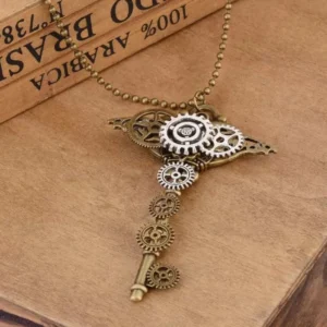 Close-up top-down view of steampunk gear key pendant showcasing intricate hollow gear design and mixed metal tones, styled on vintage wooden desktop with antique books