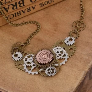Steampunk brass cog pendant necklace with mixed metal bronze silver copper gears, overhead flat lay on vintage wooden surface showcasing intricate gear details